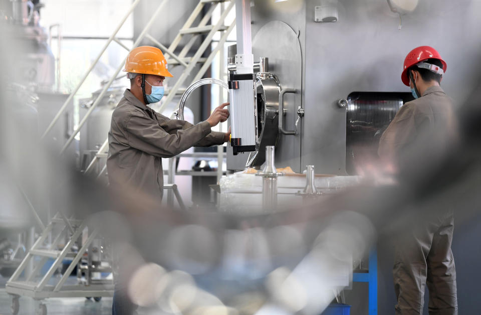 YICHUN, Feb. 24, 2020 -- Workers work on a production line to produce dry granulators, which will be supplied to drug manufacturers in Shanghai and other cities to help combat the novel coronavirus, at Wanshen Pharmaceutical Machinery Co., Ltd. in Yichun, east China's Jiangxi Province, Feb. 24, 2020. The government of Yichun has coordinated with the company to ensure the production at full capacity amid epidemic prevention and control efforts. (Photo by Zhou Liang/Xinhua via Getty) (Xinhua/Zhou Mi via Getty Images)