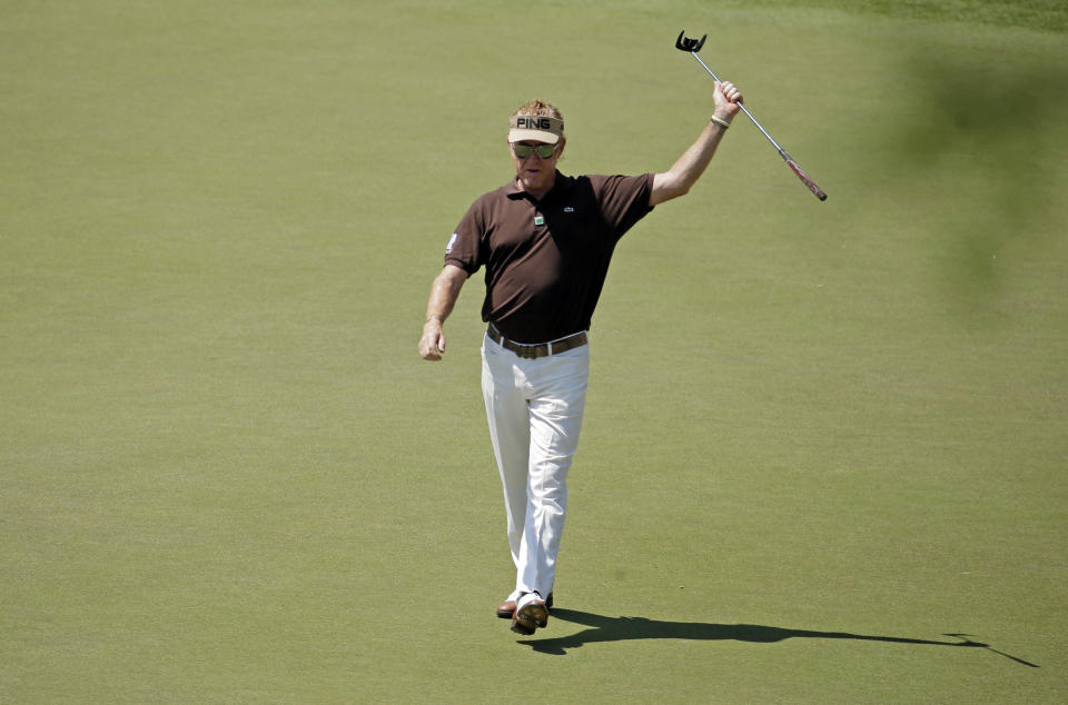 Miguel Angel Jimenez, of Spain, celebrates his fist after a birdie on the 16th hole during the third round of the Masters golf tournament Saturday, April 12, 2014, in Augusta, Ga. (AP Photo/Charlie Riedel)