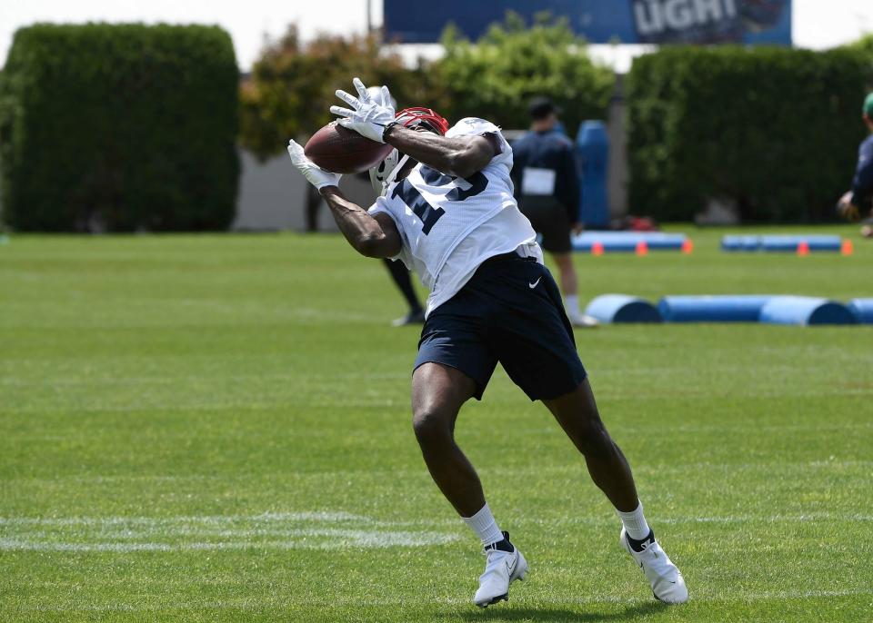 May 23, 2022; Foxborough, MA, USA; New England Patriots wide receiver Nelson Agholor (15) makes a catch at the team's OTA at Gillette Stadium. Mandatory Credit: Eric Canha-USA TODAY Sports