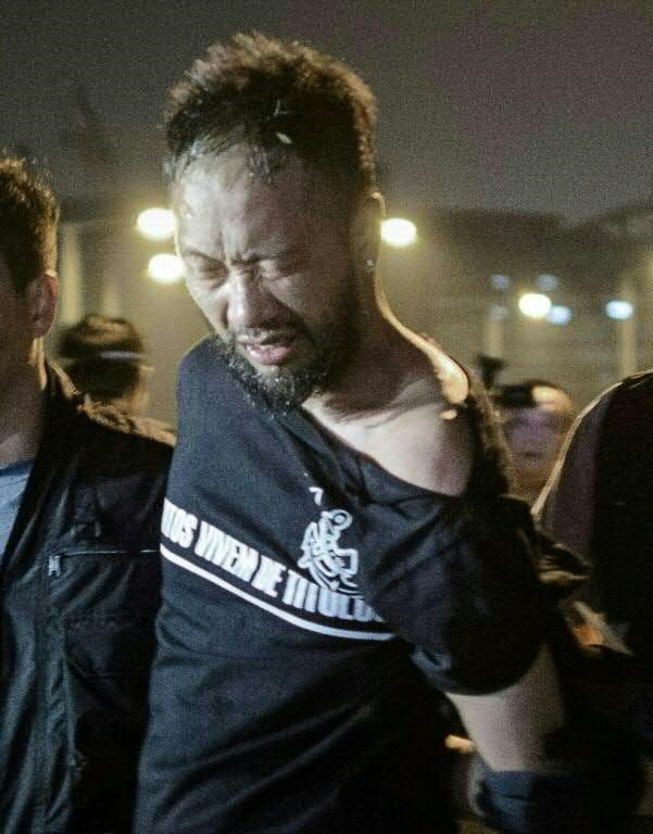 Hong Kong activist Ken Tsang was handcuffed and beaten by policemen during the 2015 pro-democracy protests