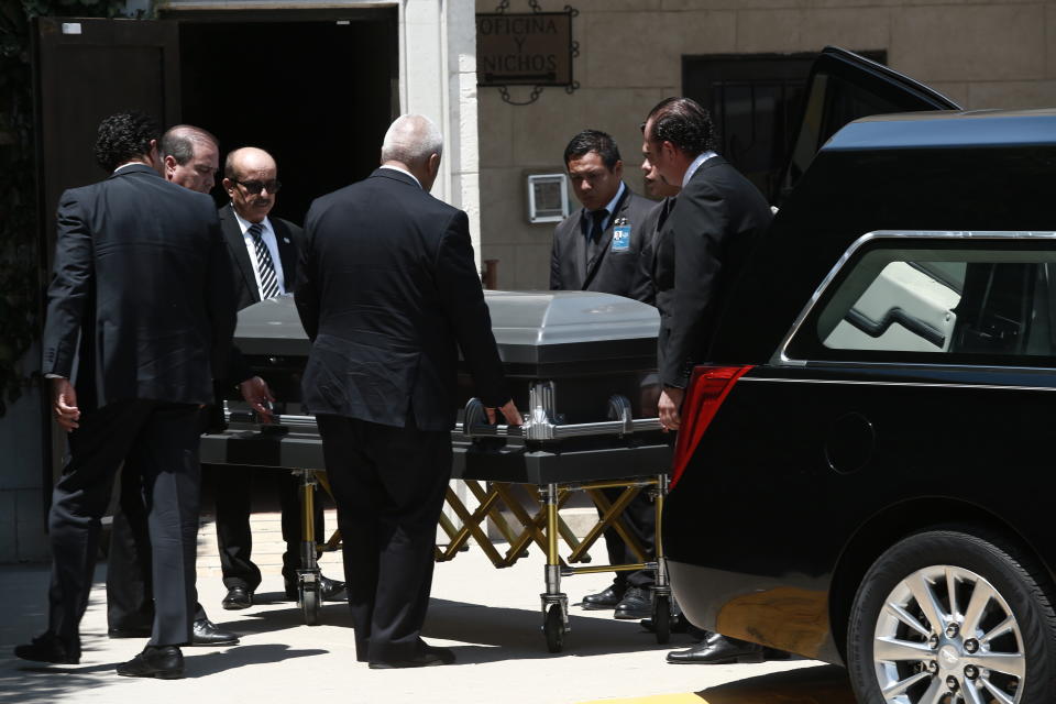 The body of Elsa Mendoza, who was killed in the El Paso mass shooting, arrives for her wake, in Juarez, Mexico, Wednesday, Aug. 7, 2019. Elsa Mendoza, 57, was an elementary school teacher from Juarez, Mexico, who lost her life while stopping by the Walmart. (AP Photo/Christian Chavez)