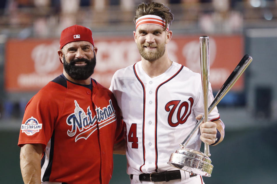 Ron Haper rapid-fired pitches to his son, Bryce, in his Home Run Derby win, and people are livid. (AP Photo)