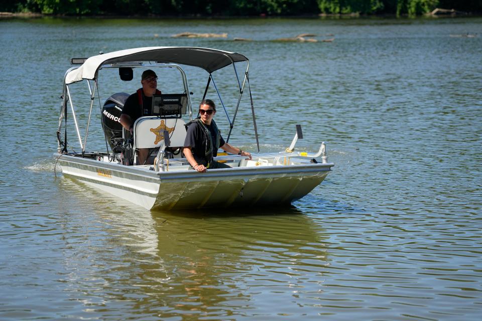 Franklin County Sheriff's deputies Stephen Withrow and Ashley Wilhoit put the dive team boat in the water before leading media on a tour Wednesday of the Scioto River where they will be patrolling during Red, White and Boom festivities on Friday.