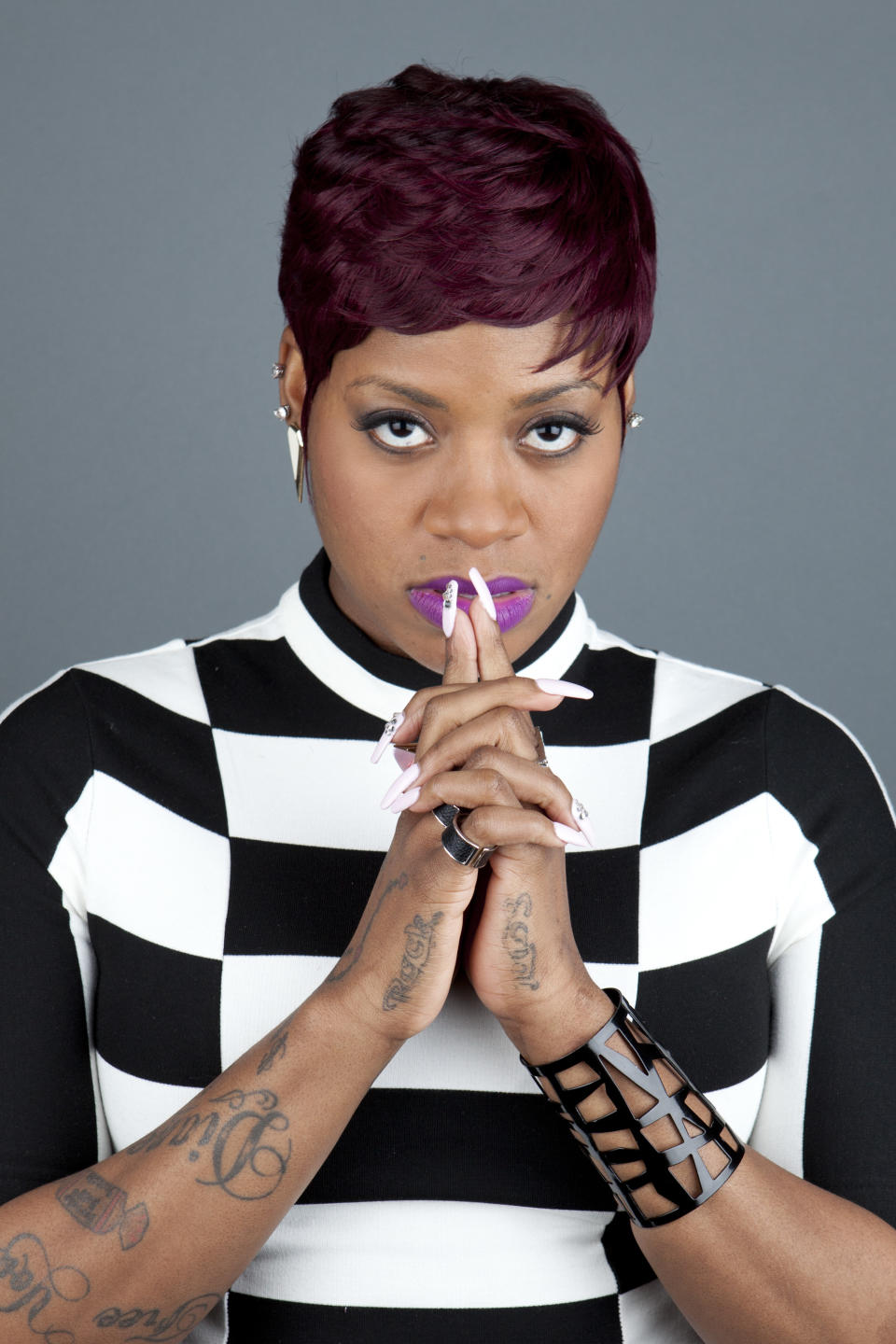 This April 24, 2013 photo shows American R&B singer Fantasia Barrino posing for a portrait to promote her new album "Side Effects of You," in New York. (Photo by Amy Sussman/Invision/AP)