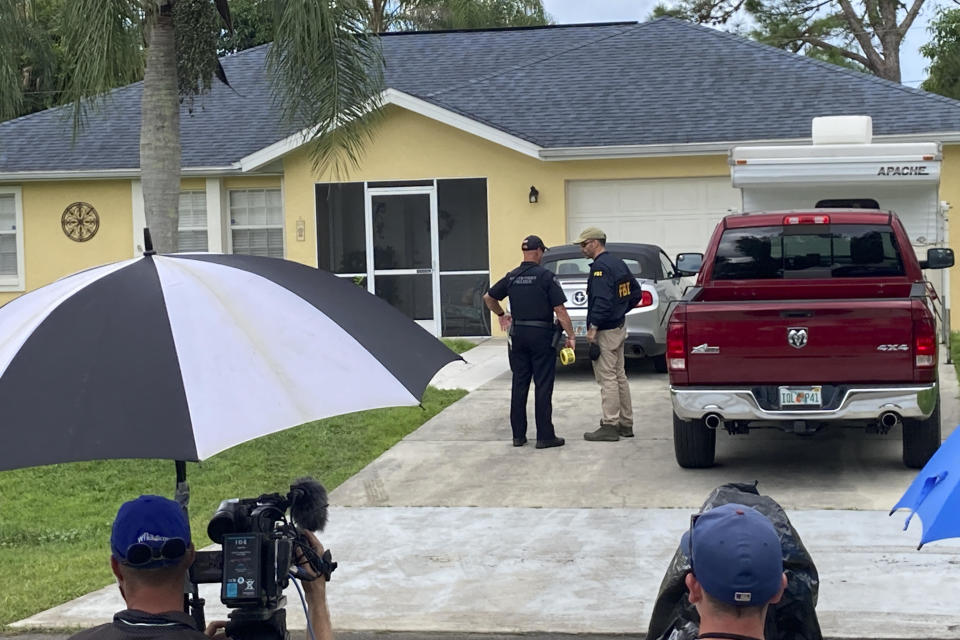 Officials investigate the home of Brian Laundrie in North Port, Florida, on September 20, 2021. / Credit: Curt Anderson / AP
