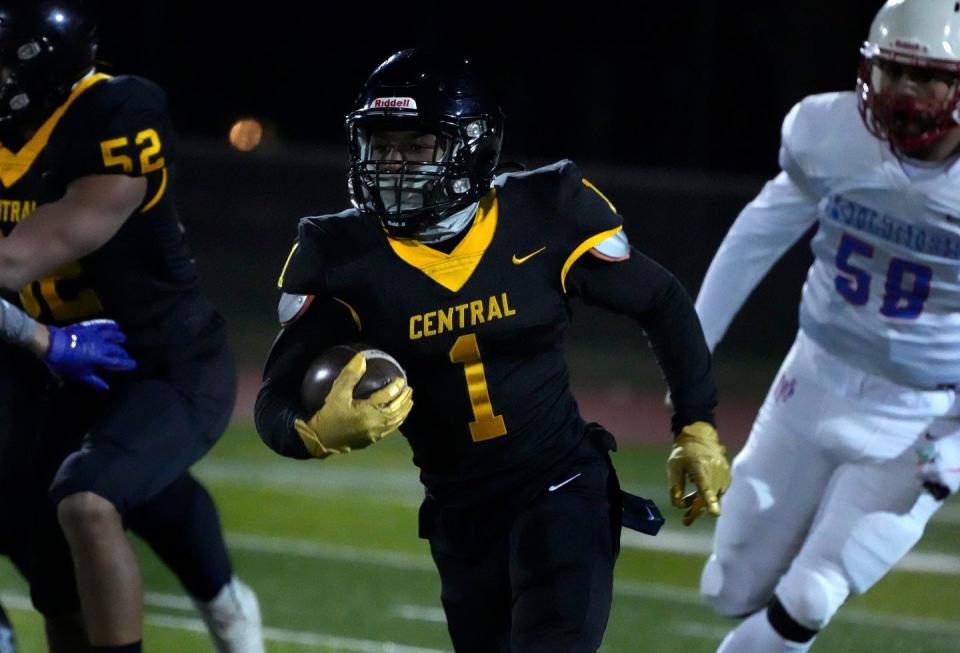 Central HS running back Armase Edouard looks for running room as he sprints downfield in the first half.