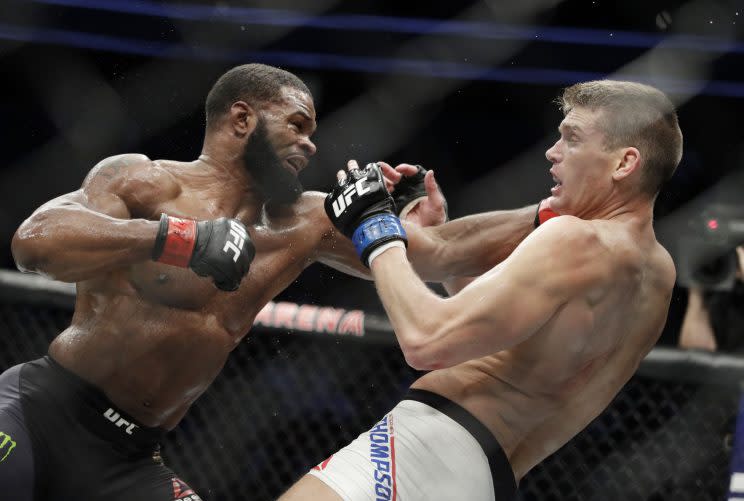 Tyron Woodley lands against Stephen ‘Wonderboy’ Thompson during Woodley’s February victory. (AP)