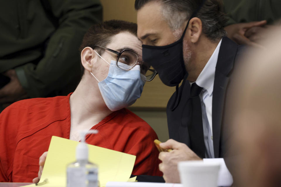 Marjory Stoneman Douglas High School shooter Nikolas Cruz speaks with capital defense attorney Casey Secor during a hearing at the Broward County Courthouse in Fort Lauderdale, Fla. on Monday, Jan. 24, 2022. (Amy Beth Bennett/South Florida Sun Sentinel via AP, Pool)