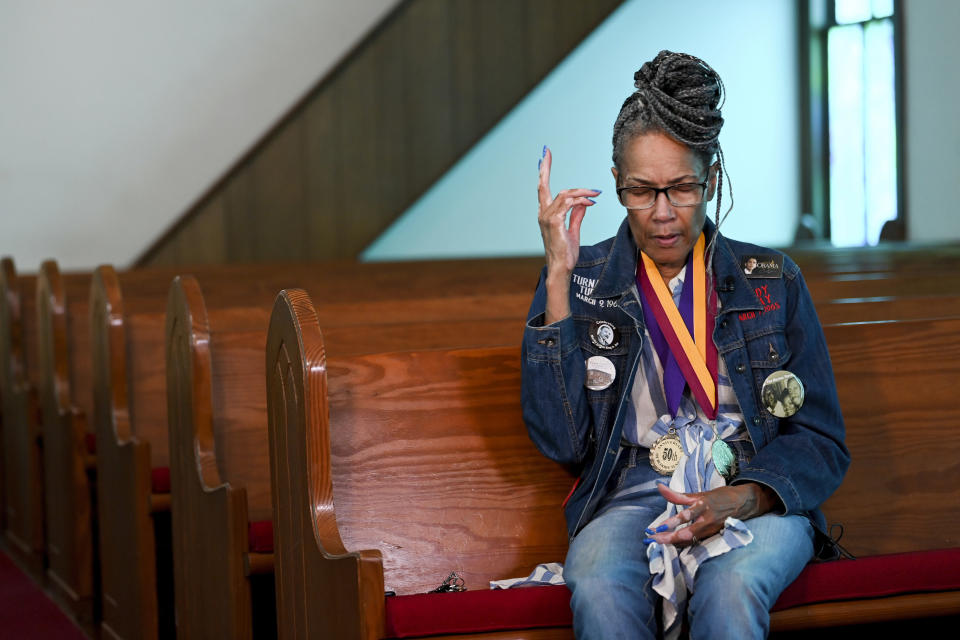 Civil Rights foot soldier Della Simpson Maynor talks on May 19, 2023, about being clubbed by police on Feb. 18, 1965, the night activist Jimmie Lee Jackson was fatally wounded, while seated near the scene of the confrontation in Zion Church in Marion, Ala. The 14-year-old Maynor was part of a group planning to march to the Perry County jail where James Orange, a local SCLC field secretary, was being held for registering voters. Maynor also heard the gunshots that killed Jackson during the struggle. (AP Photo/Julie Bennett)