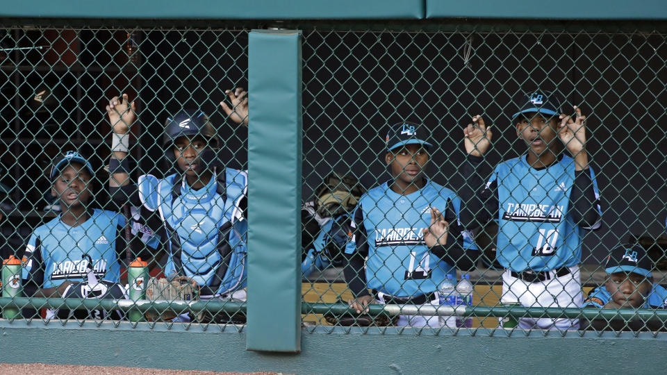 Curacao players watch the bottom of the sixth inning of the Little League World Series Championship game against River Ridge, Louisiana, in South Williamsport, Pa., Sunday, Aug. 25, 2019. (AP Photo/Gene J. Puskar)