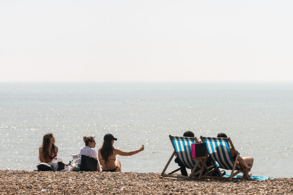 BRIGHTON, ENGLAND - APRIL 22: People enjoy the beach during the warm weather on Bank Holiday Easter Monday on April 22, 2019 in Brighton, England.  This Easter weekend has broken previous hot weather records with the warm weather expected to continue into next week. (Photo by Andrew Hasson/Getty Images)