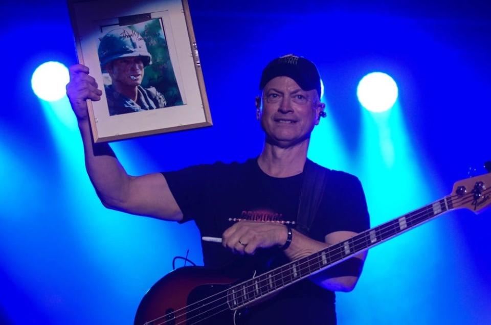 Gary Sinise, a member of the Lt. Dan Band, performs for paratroopers and their families during a concert at March 4, 2017, at Fort Bragg.