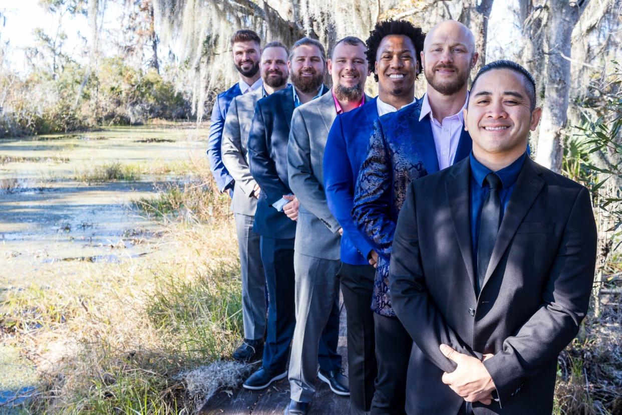 Luke Hawx (second from right) is just as proud to see his wrestlers in movies as he is himself.