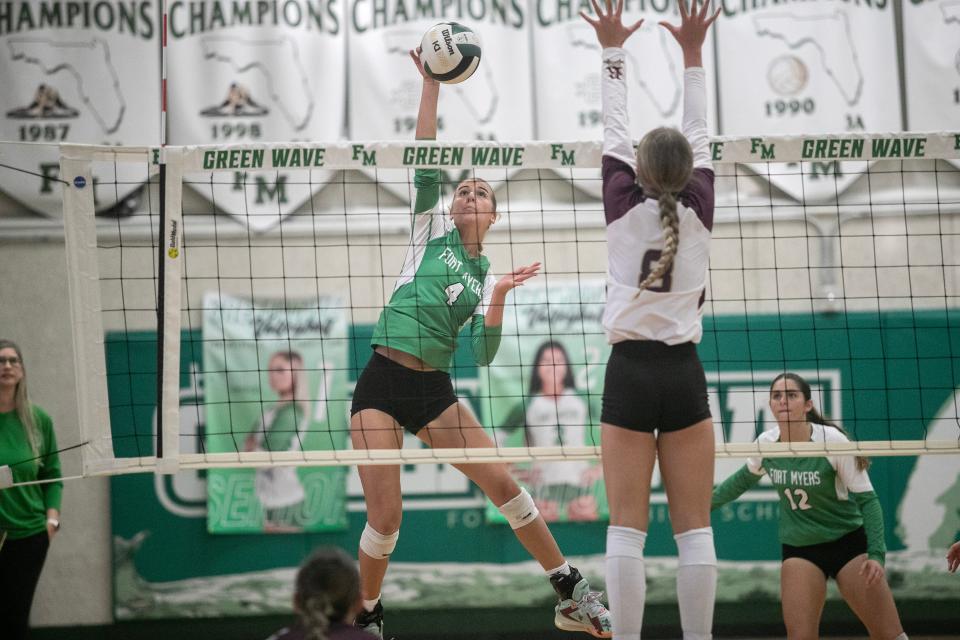 Gabby Dwyer of Fort Myers hits as Olivia Znotens of Riverdale goes up for a block in the 6A Volleyball Regional Semifinals on Saturday, Oct. 28, 2023, in Fort Myers.