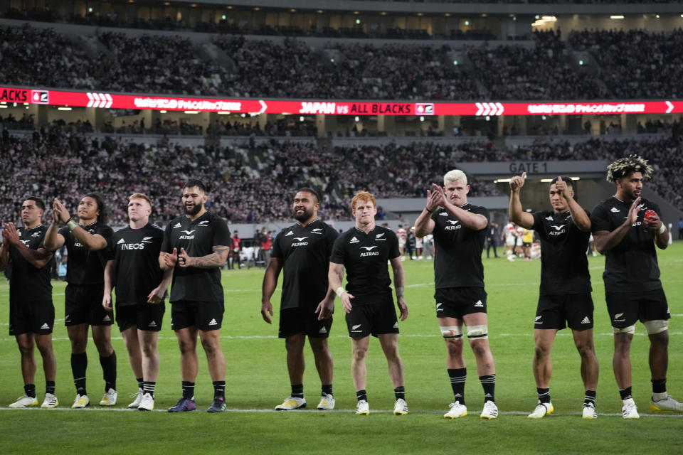 New Zealand All Blacks players greets the spectators after winning over Japan during a rugby test match between the All Blacks and Japan at the National Stadium in Tokyo, Japan, Saturday, Oct. 29, 2022. (AP Photo/Shuji Kajiyama)