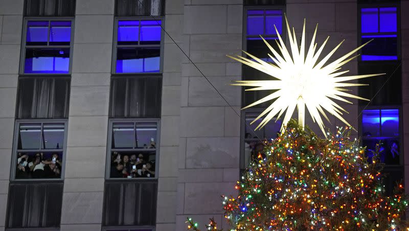 The Rockefeller Center Christmas tree is lit on Wednesday, Nov. 29, 2023, in New York.