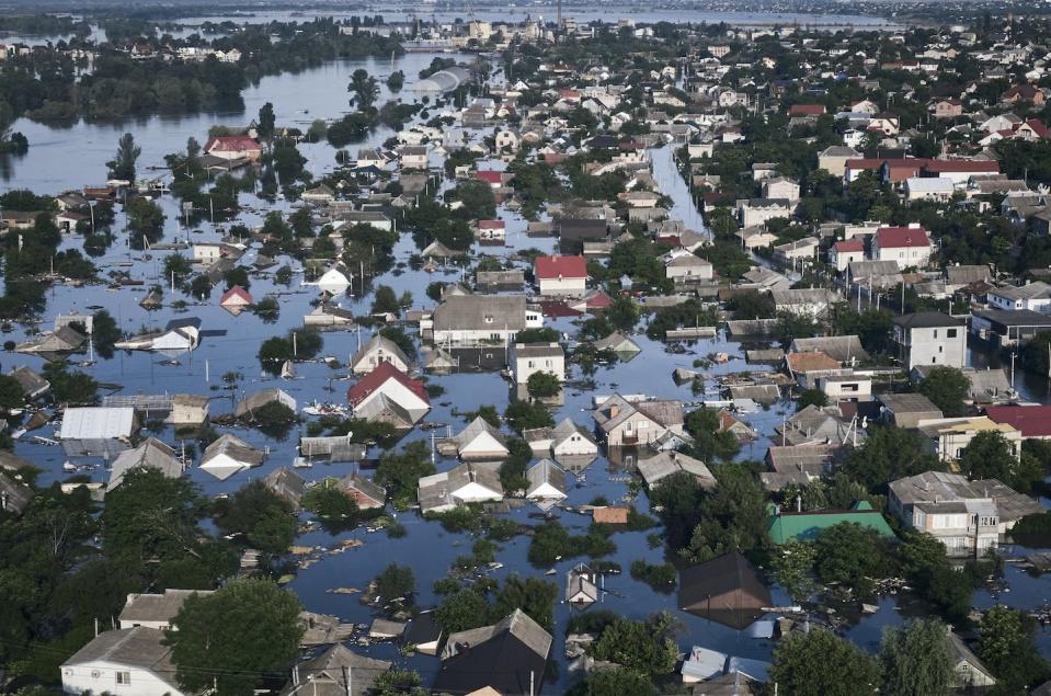 Streets are flooded in Kherson, Ukraine, after the Kakhovka dam was blown up by Russian forces. While the war in Ukraine is largely conventional, the use of paramilitary forces by both sides could escalate hostilities in the months to come. (AP Photo/Libkos)