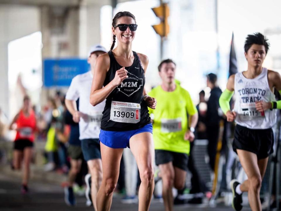 Edmonton Runner Dania Spillett running in the Scotiabank half-marathon in Toronto in 2019. Spillett has questions about what a bout with COVID-19 might mean for her recovery as an athlete.  (Jody Bailey - image credit)