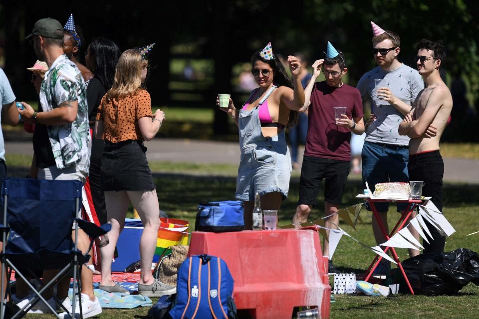 Revellers soaked up rays in Victoria Park, London (AFP via Getty Images)