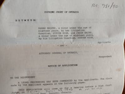 A photo of the paperwork pertaining to the lawsuit the author’s youth group launched and then dropped. (Steven High)