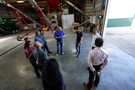 Members of Illinois Soybean Growers Association and a trade group of grain buyers from Sri Lanka meet at the Pioneer-DuPont Seed facility in Addieville, Illinois U.S., September 19, 2018. Picture taken September 19, 2018. REUTERS/Lawrence Bryant