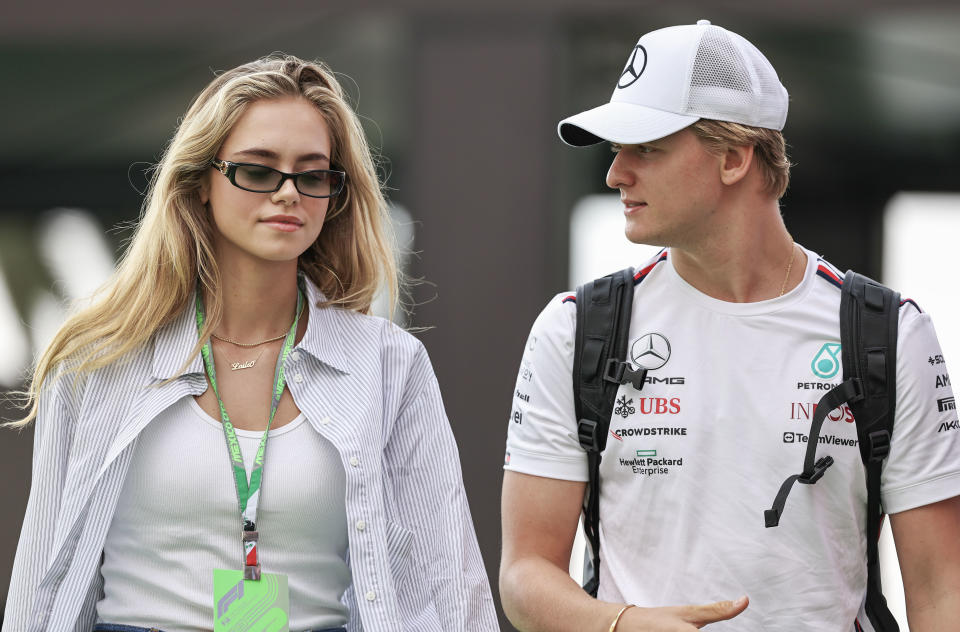 MEXICO CITY, MEXICO - OCTOBER 28: Mick Schumacher of Germany and Mercedes-AMG PETRONAS F1 Team and Laila Hasanovic arrive at the track during qualifying ahead of the F1 Grand Prix of Mexico at Autodromo Hermanos Rodriguez on October 28, 2023 in Mexico City, Mexico. (Photo by Song Haiyuan/MB Media/Getty Images)