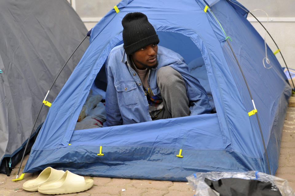 A Sub-saharan migrant looks on as he and other Sub-saharan migrants camp in front of the International Organization for Migration office as they seeks shelter and protection amidst attacks on them, in Tunis, Tunisia, Thursday, March 2, 2023. (AP Photo/Hassene Dridi)