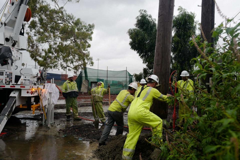 PHOTO: A power line pole is replaced on the East Side of Long Beach, California, August 20, 2023 as Tropical Storm Hilary arrives. (Zaydee Sanchez/Reuters)