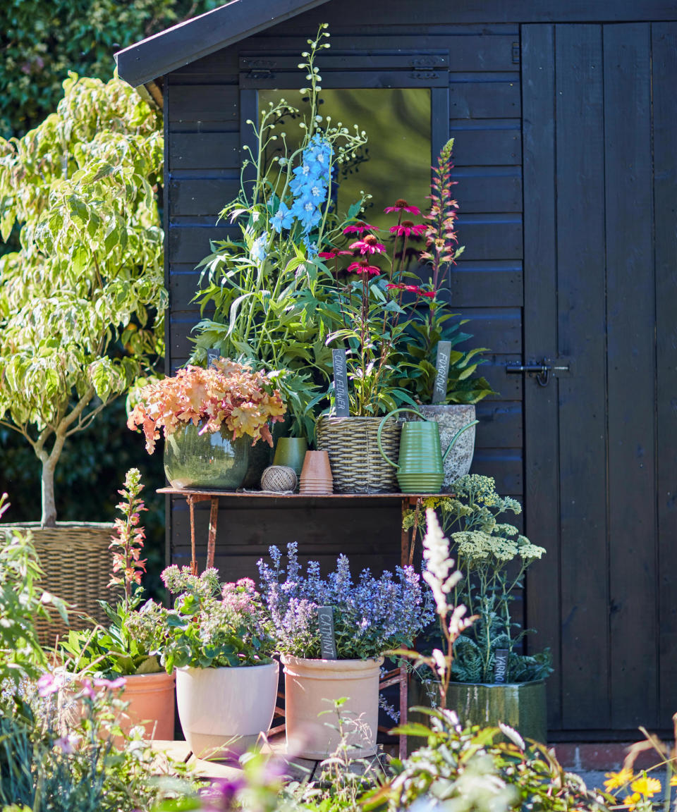 A stacked container garden with a rustic theme