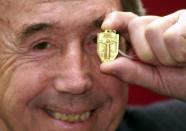 <p>Ex-England goalkeeper Gordon Banks, holds his 1966 World Cup winner’s medal at a photocall at Christie’s South Kensington. </p>