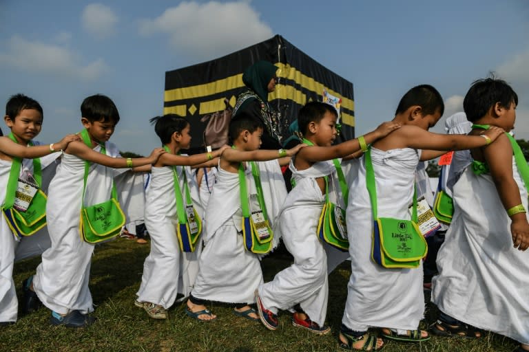 Thousands of Malaysian children took part in a practice run for the Muslim hajj pilgrimage on Monday, walking round a model of the holy Kaaba shrine under the tropical sun