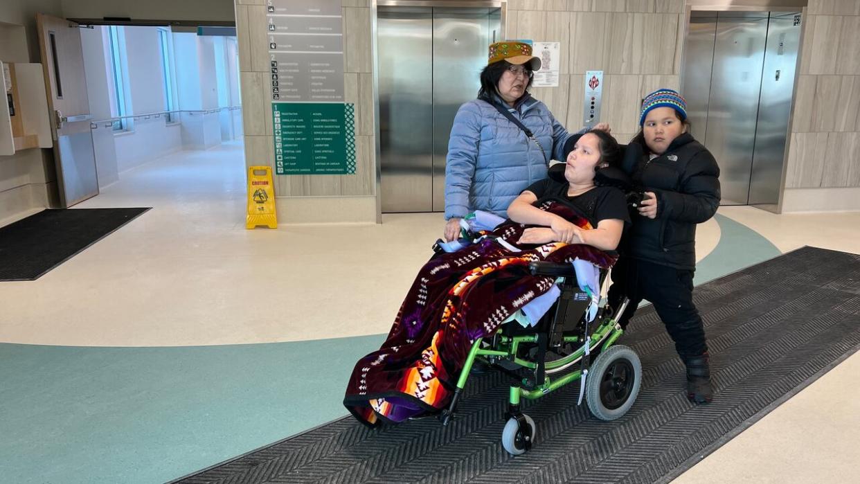 Violet Martin, left, with her daughter Vicki Lee and her son Daylan. Martin says she was frustrated this past weekend trying to find accessible-transit options when Vicki Lee needed to get to the hospital. (Travis Burke / CBC - image credit)