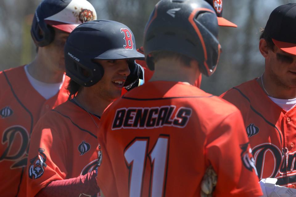 Diman Voke’s Aaron Moniz is congratulated by teammates after a homer on Wednesday.