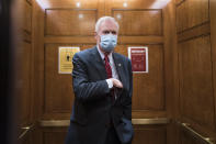 Sen. Ron Johnson, R-Wis., steps into an elevator as the Senate holds a voting marathon on the Democrats' $1.9 trillion COVID-19 relief bill that's expected to end with the chamber's approval of the measure, at the Capitol in Washington, Friday, March 5, 2021. When the Senate took up the measure on Thursday, Johnson forced an extraordinary half-day holdup on the bill by demanding the chamber's clerks read aloud the entire 628-page measure which took 10 hours and 44 minutes and ended shortly after 2 a.m. (AP Photo/J. Scott Applewhite)