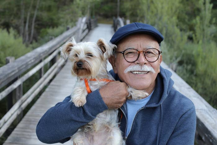 A man hugging his dog