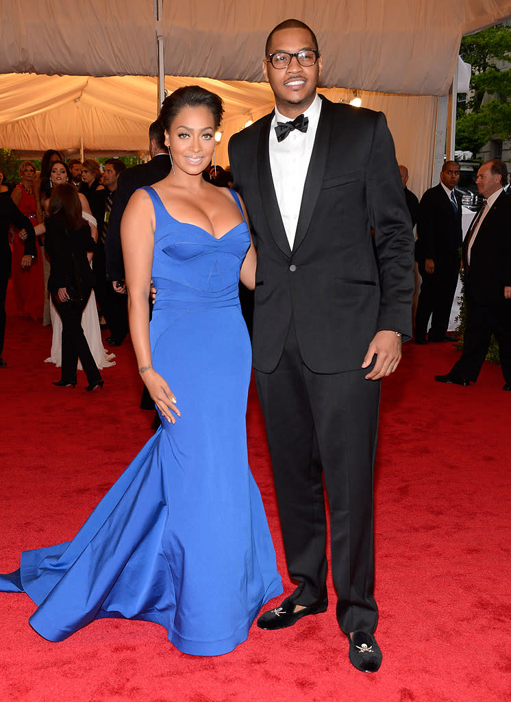 New York Knicks star Carmelo Anthony came clad in a tux, glasses, and comfy velvet skull slippers, while his wife La La flaunted her fab physique in a bright blue gown.