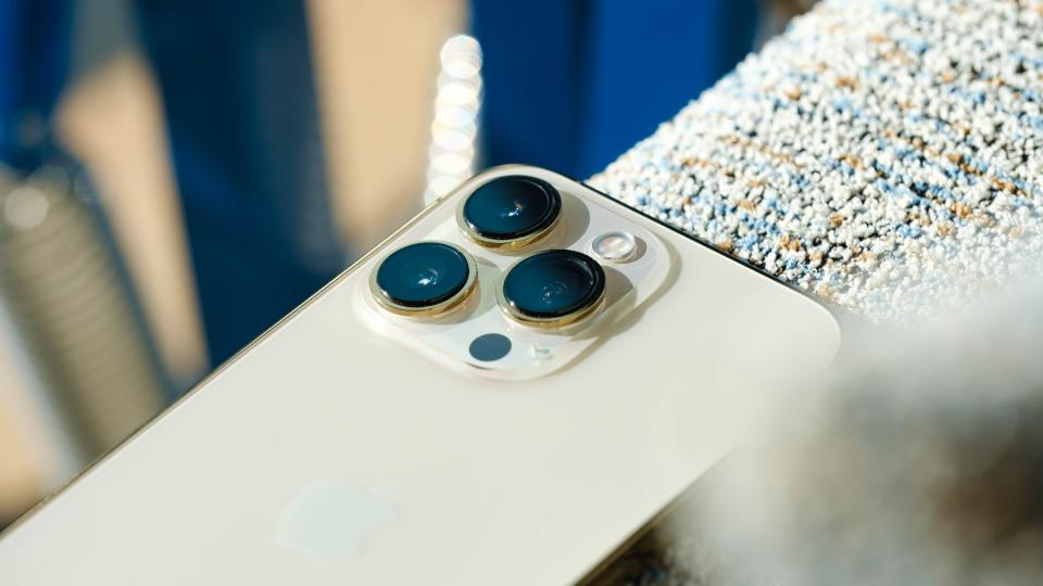 Close up of the gold iPhone 13 Pro's triple rear cameras