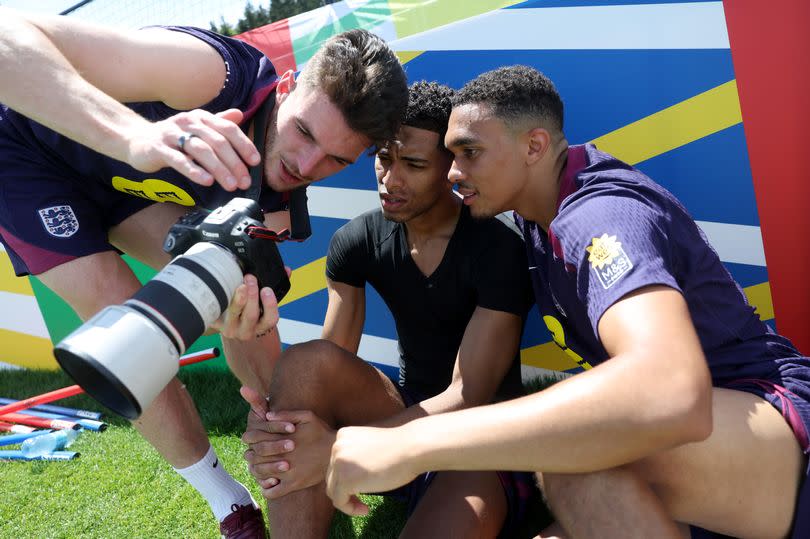 Declan Rice, Jude Bellingham and Trent Alexander-Arnold of England look at a camera during a training session at Spa & Golf Resort Weimarer Land on June 18, 2024 in Blankenhain, Germany.