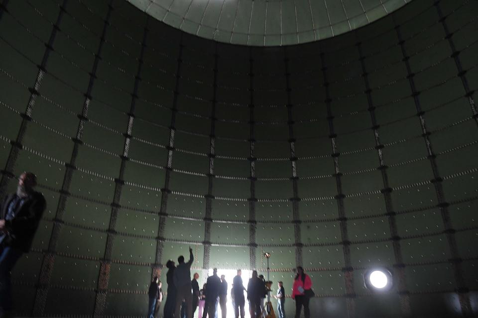 Visitors look around a renewable gas storage facility during a tour Friday at the Verbio plant in Nevada, the first industrial-scale renewable natural gas facility in North America using agricultural residue as its feedstock.