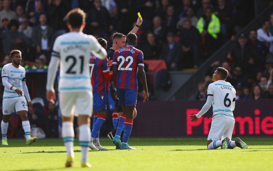 Thiago Silva receives a yellow card for handling the ball - Conor Gallagher marks return to Crystal Palace with last-gasp winner for Chelsea - REUTERS
