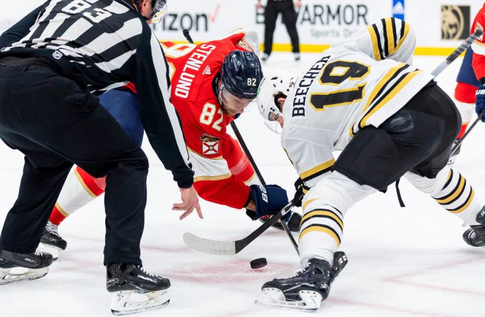 Florida Panthers center Kevin Stenlund (82) and Boston Bruins center John Beecher (19) face-off in the second period of Game 1 of the second-round series of the Stanley Cup Playoffs on Monday, May 6, 2024, in Sunrise, Fla.