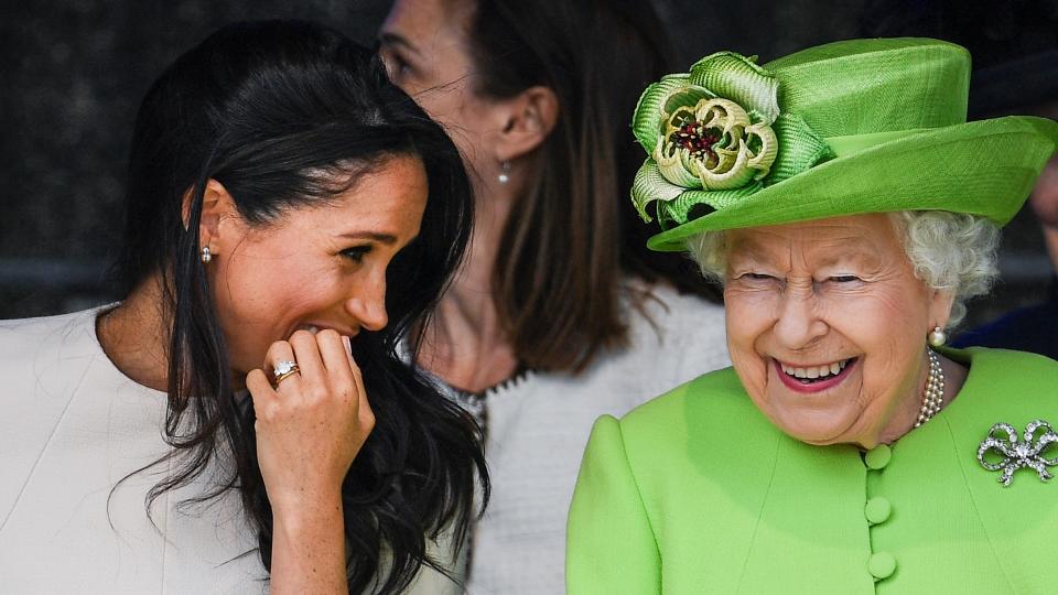 Queen Elizabeth II sitts and laughs with Meghan, Duchess of Sussex during a ceremony to open the new Mersey Gateway Bridge on June 14, 2018 in the town of Widnes in Halton, Cheshire, England. Meghan Markle married Prince Harry last month to become The Duchess of Sussex and this is her first engagement with the Queen. During the visit the pair will open a road bridge in Widnes and visit The Storyhouse and Town Hall in Chester.