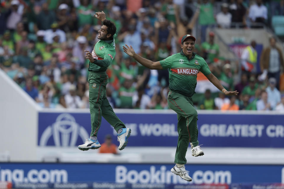 Bangladesh's Mehedi Hasan, left, celebrates taking the wicket of South Africa's captain Faf du Plessis during the Cricket World Cup match between South Africa and Bangladesh at the Oval in London, Sunday, June 2, 2019. (AP Photo/Matt Dunham)