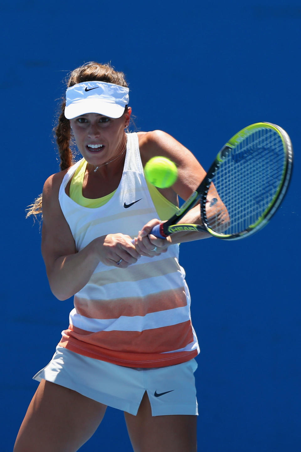 Michelle Larcher De Brito of Portugal plays backhand her first round match against Ekaterina Makarova of Russia during day one of the 2013 Australian Open at Melbourne Park on January 14, 2013 in Melbourne, Australia. 