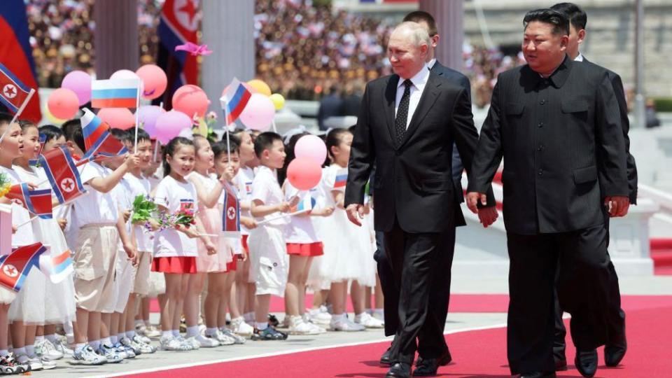 In this pool photograph distributed by the Russian state agency Sputnik, people release balloons in the air as Russia's President Vladimir Putin and North Korea's leader Kim Jong Un attend a welcoming ceremony at Kim Il Sung Square in Pyongyang on June 19, 2024.