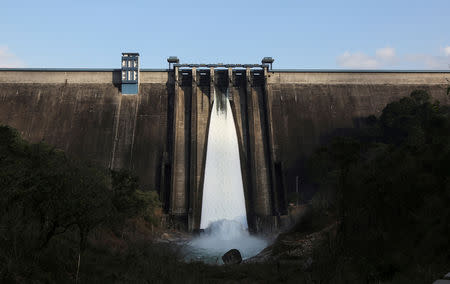 A general view of Cheruthoni dam with one open gate is seen in Idukki, Kerala, India, September 5, 2018. REUTERS/Sivaram V/File Photo