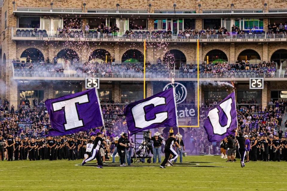 The TCU cheer team introduced the team prior to a Big XII conference game between the TCU Horned Frogs and the West Virginia Mountaineers at Amon G. Carter Stadium in Fort Worth on Saturday, Sept. 30, 2023. Chris Torres/ctorres@star-telegram.com