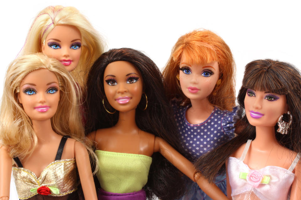 Trowbridge, Wiltshire, UK - April 23, 2014: Photograph of  a group of Barbie dolls from Mattel.