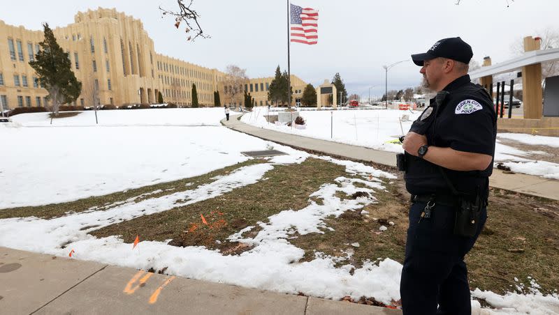 Ogden City Police officer Chavis Whitby stands outside of Ogden High School after false threats of shots fired on March 29, 2023. The flag was lowered to half-staff in honor of the recent Nashville, Tenn., school shooting victims. Police agencies along the Wasatch Front and northern Utah responded to similar reports of school violence on Wednesday morning.