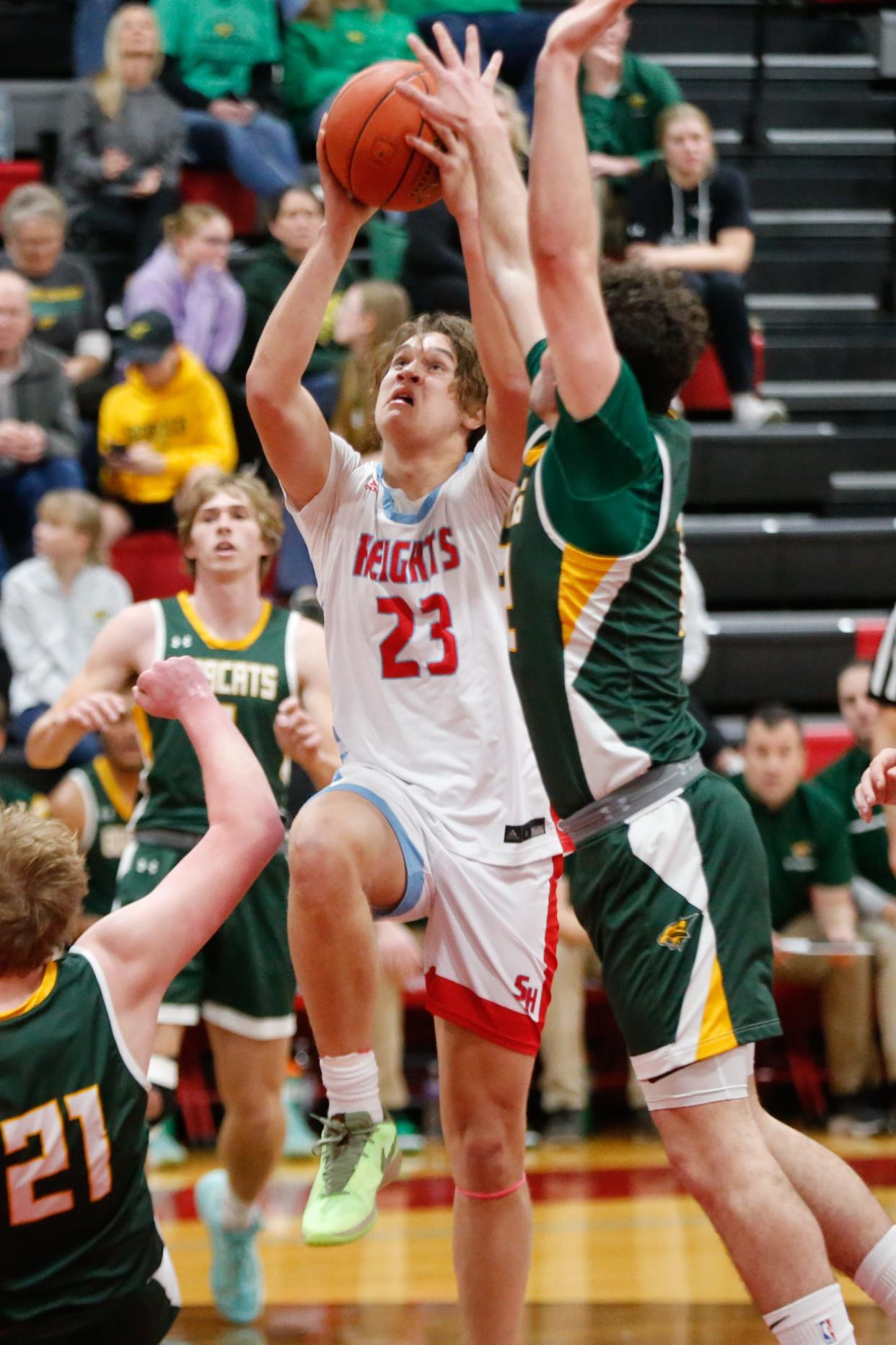 Shawnee Heights junior Jaret Sanchez (23) goes up for a layup against Basehor-Linwood in the first half of the game Tuesday, Jan. 30, 2024, inside Shawnee Heights High School.